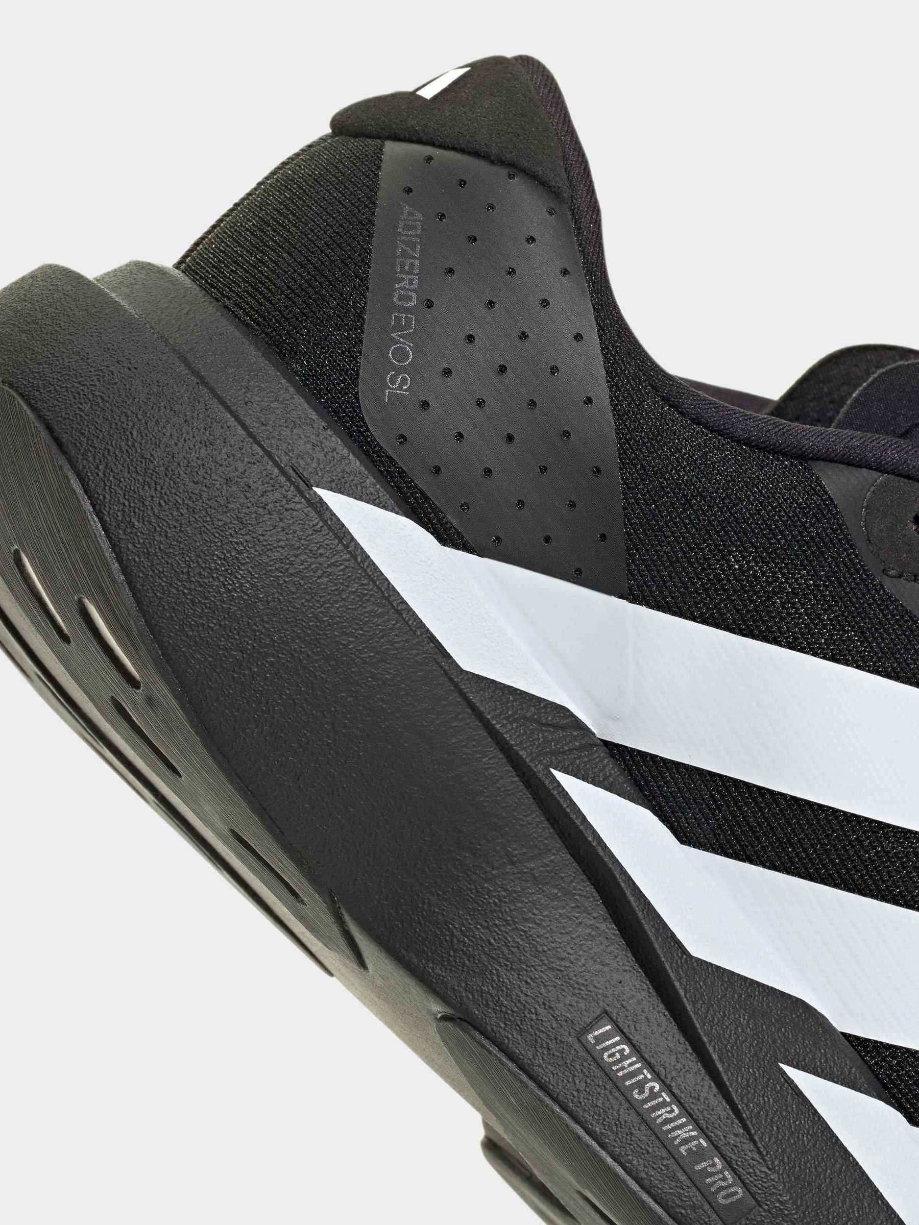 Buy adidas Black/White adizero Evo SL Junior Trainers from the
