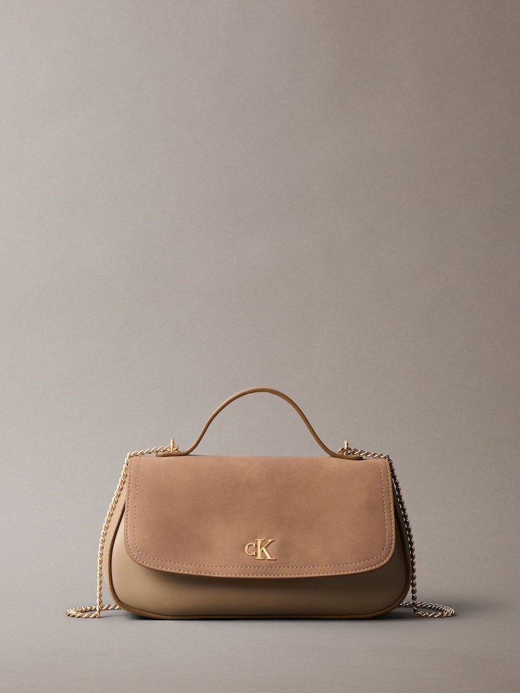 Calvin Klein Monogram Flap Sueded Camera Bag - صورة 1 من 5 Calvin Klein Monogram Flap Sueded Camera Bag - صورة 1 من 5