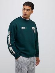 River Island Green Oversized Alpine Badging Crew Neck T-Shirt - Image 1 of 4