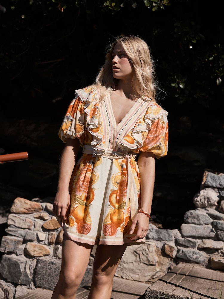 Emily Carter Floral Ruffle Neckline Puff Sleeve Playsuit - Image 1 of 11 Emily Carter Floral Ruffle Neckline Puff Sleeve Playsuit - Image 1 of 11