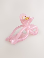 ורוד - סיכת שיער בדוגמת פפיון משרף סינתטי - תמונה 1 מתוך 3