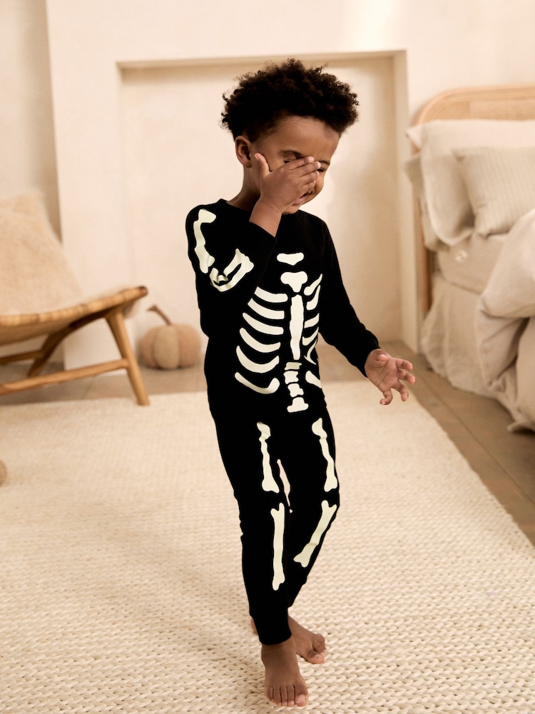 Black Glow in the Dark Skeleton Halloween Pyjamas (9mths-12yrs) - Image 1 of 3 Black Glow in the Dark Skeleton Halloween Pyjamas (9mths-12yrs) - Image 1 of 3