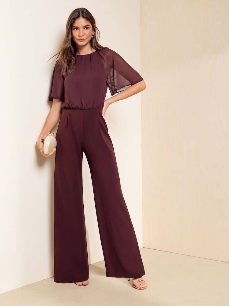 Friends Like These Aubergine Purple Chiffon Flutter Sleeve Jumpsuit - Image 1 of 5 Friends Like These Aubergine Purple Chiffon Flutter Sleeve Jumpsuit - Image 1 of 5