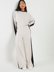 River Island Cream Petite Premium Colour Block Wide Leg Trousers - Image 1 of 4