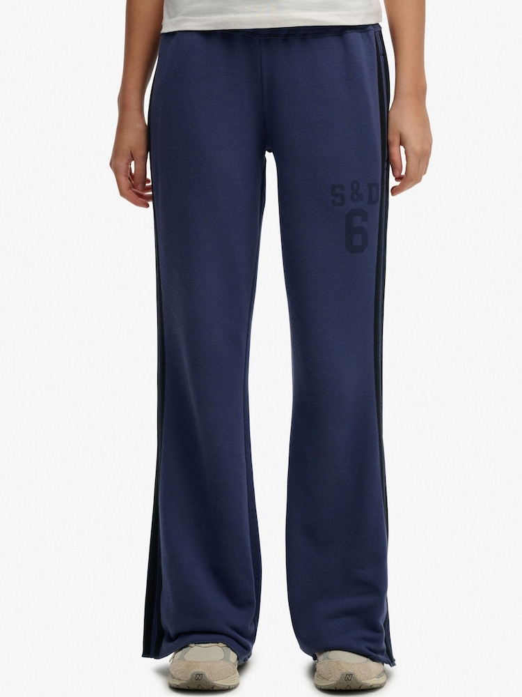 SUPERDRY Blue SUPERDRY Athletic Essentials Stripe Flare Joggers - Image 1 of 5 SUPERDRY Blue SUPERDRY Athletic Essentials Stripe Flare Joggers - Image 1 of 5
