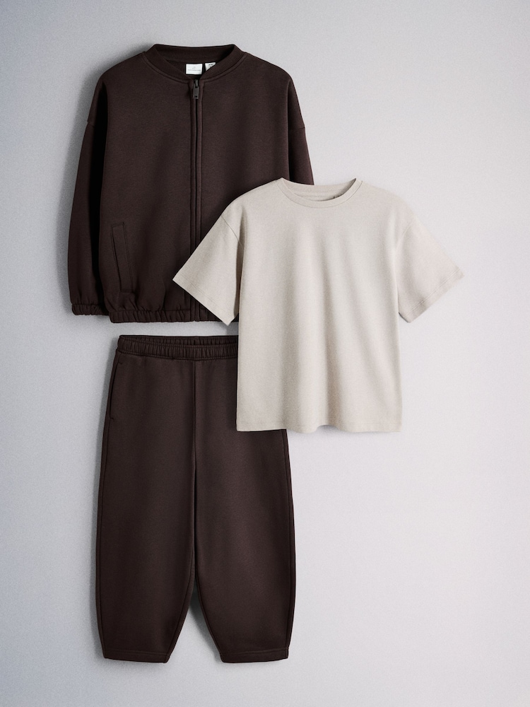 The Set 3 Piece Jersey Zip Through Bomber Short Sleeve Oversized T-Shirt and Barrel Jogger Set Chocolate Brown/Cream - Image 1 of 6
