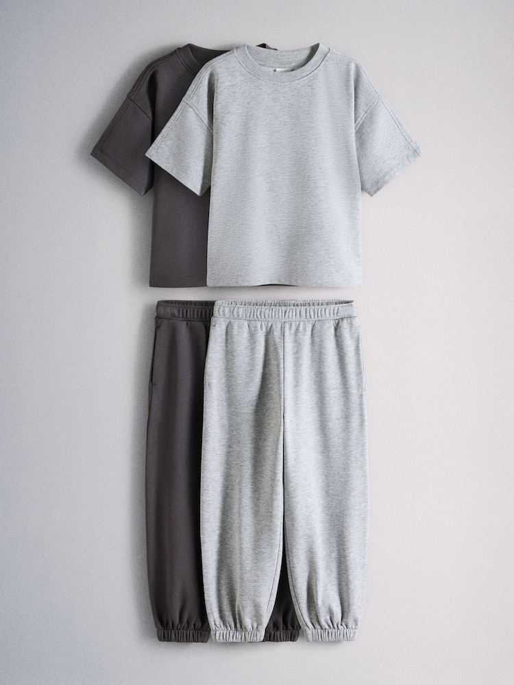 The Set 2 Pack Oversized Short Sleeve Crew and Relaxed Cuff Joggers Charcoal Grey/Grey Marl - Image 1 of 7 The Set 2 Pack Oversized Short Sleeve Crew and Relaxed Cuff Joggers Charcoal Grey/Grey Marl - Image 1 of 7