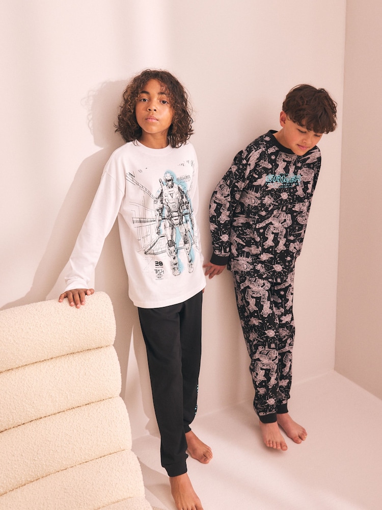 Black/Blue Gamer Long Sleeve Pyjamas 2 Pack (3-16yrs) - Image 1 of 4 Black/Blue Gamer Long Sleeve Pyjamas 2 Pack (3-16yrs) - Image 1 of 4