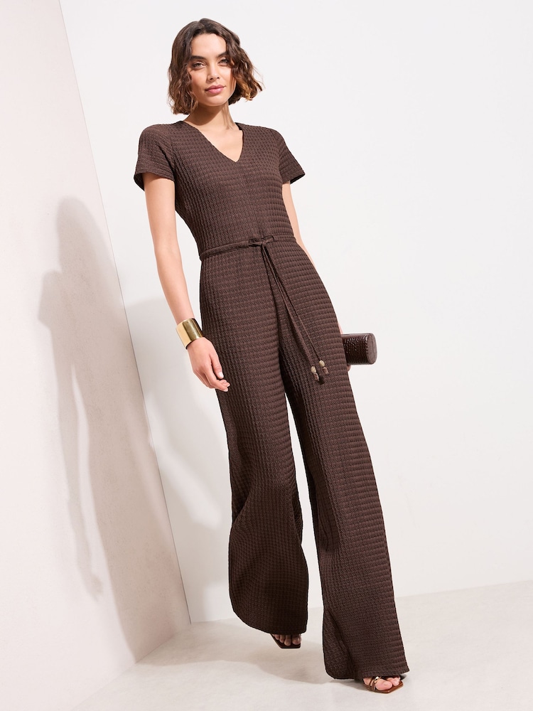 Friends Like These Chocolate Brown Petite Short Sleeve Jersey Textured Jumpsuit - Image 1 of 4 Friends Like These Chocolate Brown Petite Short Sleeve Jersey Textured Jumpsuit - Image 1 of 4