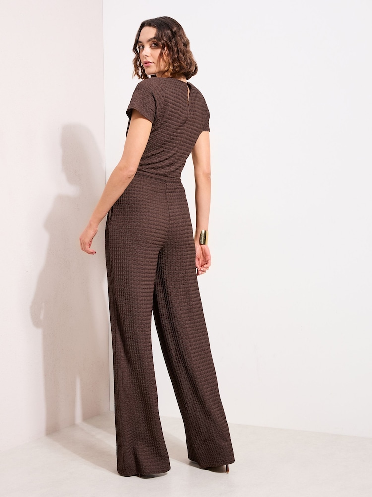 Friends Like These Chocolate Brown Petite Short Sleeve Jersey Textured Jumpsuit - Image 4 of 4 Friends Like These Chocolate Brown Petite Short Sleeve Jersey Textured Jumpsuit - Image 4 of 4