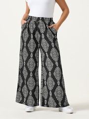 Yours Curve Black Floral Blur Print Trousers 28" - Image 1 of 5