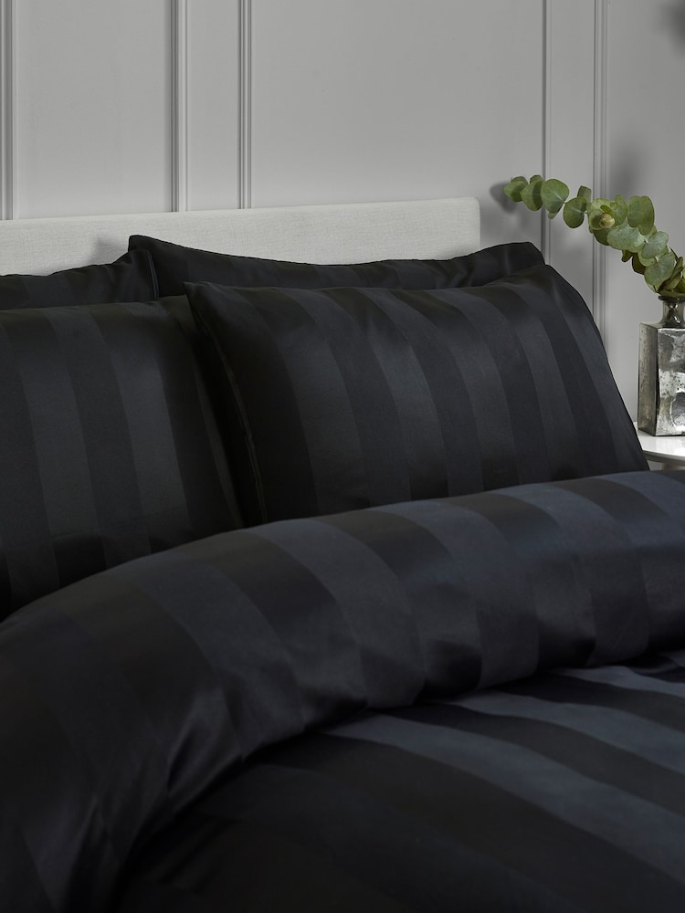 Catherine Lansfield 4 Pack Black So Soft Satin Stripe Non Iron Pillowcases - Image 1 of 2 Catherine Lansfield 4 Pack Black So Soft Satin Stripe Non Iron Pillowcases - Image 1 of 2
