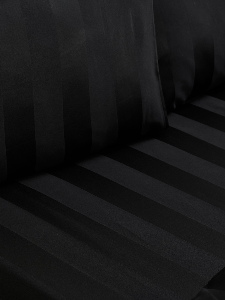 Catherine Lansfield 4 Pack Black So Soft Satin Stripe Non Iron Pillowcases - Image 2 of 2 Catherine Lansfield 4 Pack Black So Soft Satin Stripe Non Iron Pillowcases - Image 2 of 2