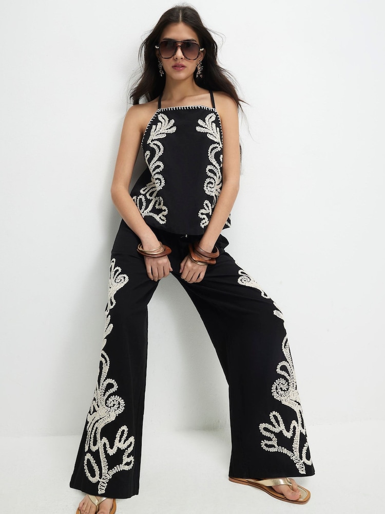 מכנסיים רקומים בגזרה רחבה של River Island - תמונה 1 מתוך 4