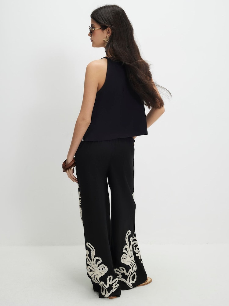 מכנסיים רקומים בגזרה רחבה של River Island - תמונה 2 מתוך 4