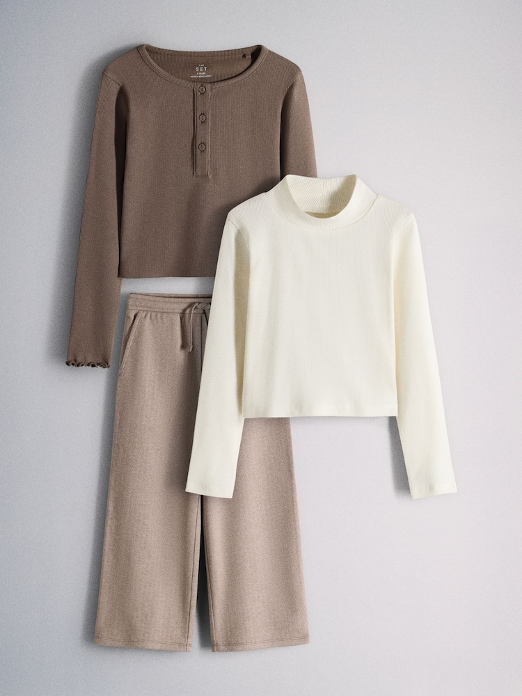 The Set 3 Piece Long Sleeve Henley, Long Sleeve Roll Neck Top and Wide Leg Trousers Set Brown/Cream/Herringbone - Image 1 of 6 The Set 3 Piece Long Sleeve Henley, Long Sleeve Roll Neck Top and Wide Leg Trousers Set Brown/Cream/Herringbone - Image 1 of 6