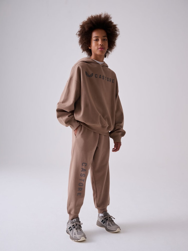 صخري - طقم من هودي كبير الحجم وبنطلون رياضي من Castore - Image 2 of 9