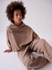 صخري - طقم من هودي كبير الحجم وبنطلون رياضي من Castore - Image 3 of 9