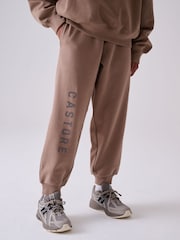 صخري - طقم من هودي كبير الحجم وبنطلون رياضي من Castore - Image 7 of 9