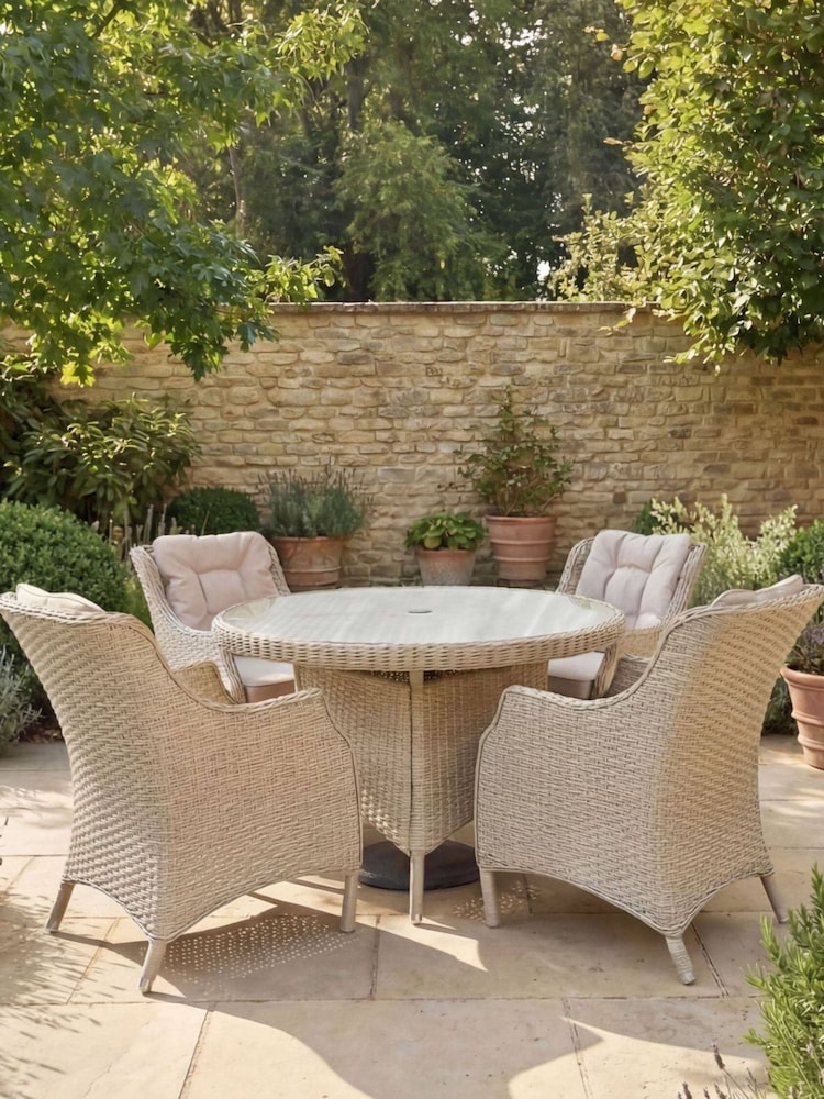 Bramblecrest Sandstone Woodchester 120cm Round Table with 4 Dining Armchairs & Parasol - Image 2 of 6 Bramblecrest Sandstone Woodchester 120cm Round Table with 4 Dining Armchairs & Parasol - Image 2 of 6