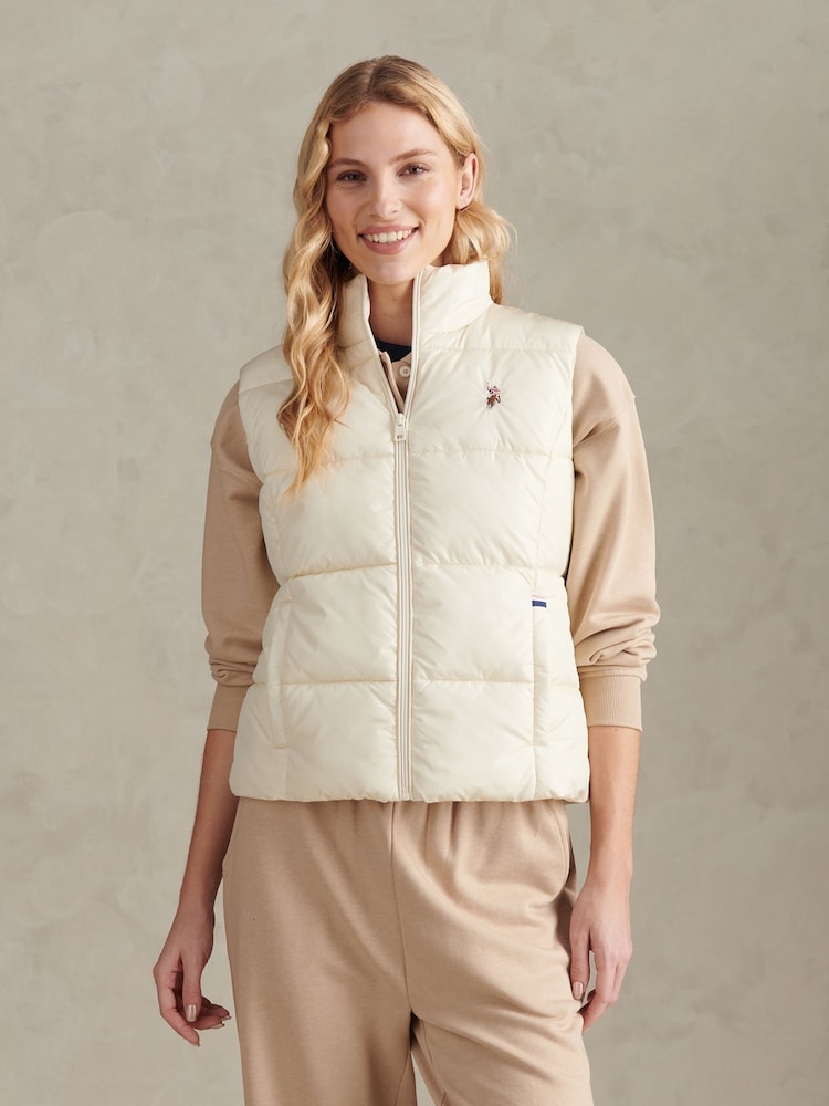 U.S. Polo Assn. Cream Lightweight Puffer Gilet - Image 1 of 10 U.S. Polo Assn. Cream Lightweight Puffer Gilet - Image 1 of 10