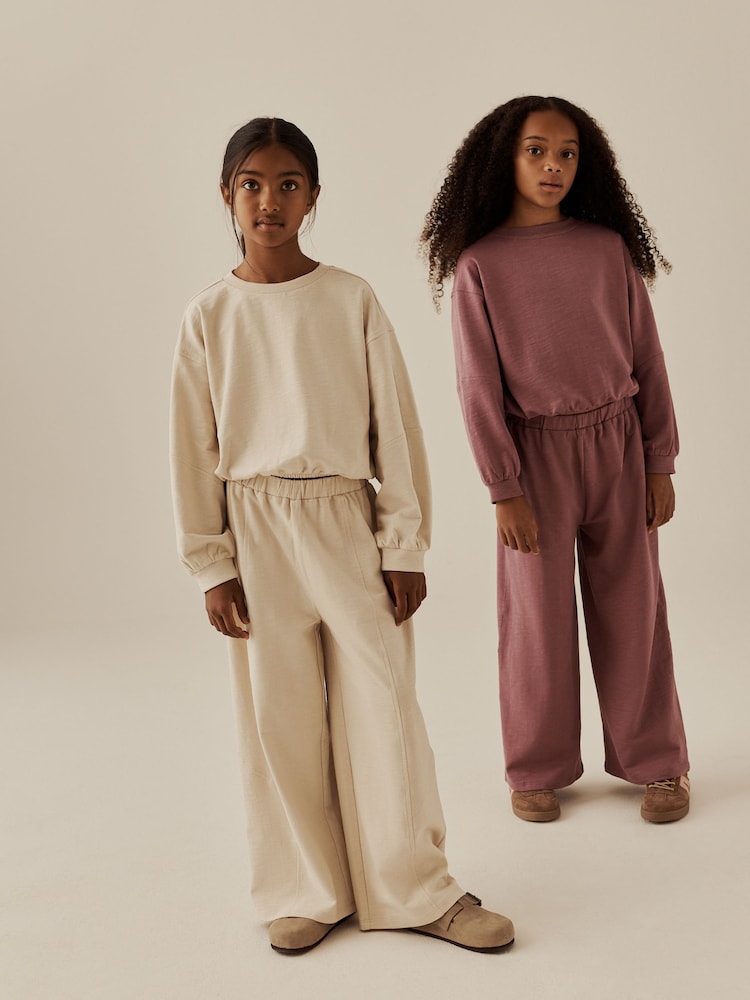 Mauve/Oatmeal Long Sleeve and Wide Leg Top & Joggers Set 2 Pack (3-16yrs) - Image 1 of 7 Mauve/Oatmeal Long Sleeve and Wide Leg Top & Joggers Set 2 Pack (3-16yrs) - Image 1 of 7
