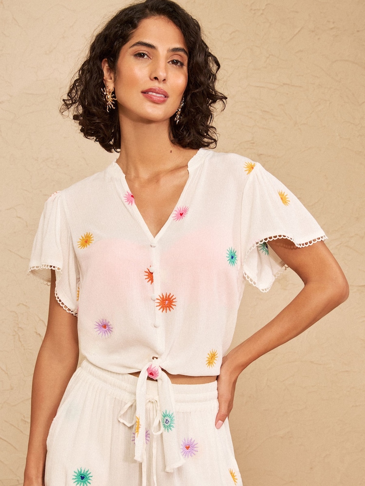 Love & Roses Ivory Sun Embroidered Tie Front Beach Top - Image 1 of 4