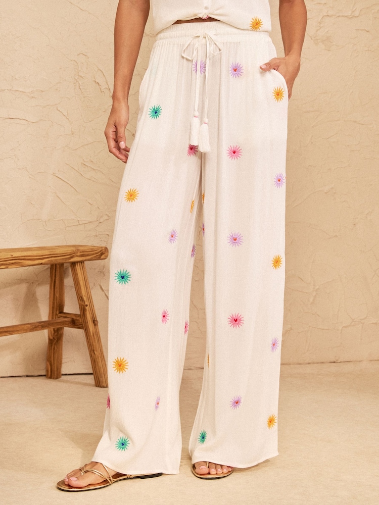 Love & Roses Ivory Sun Embroidered Wide Leg Beach Trousers - Image 1 of 5