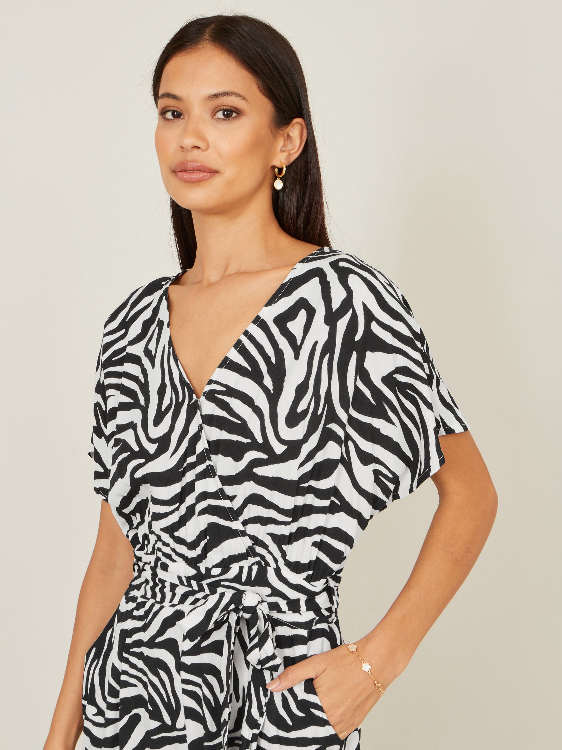 Buy Yumi Black Zebra Print Relaxed Jumpsuit from the Next UK