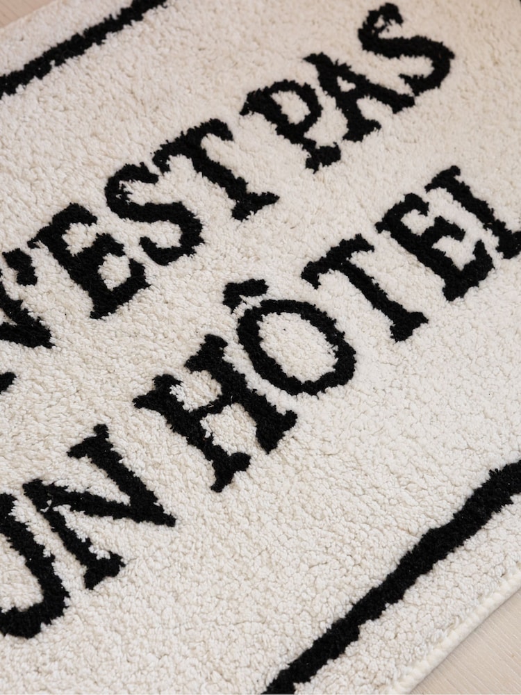 Rockett St George Black/White Hotel Slogan Bath Mat - Image 2 of 6 Rockett St George Black/White Hotel Slogan Bath Mat - Image 2 of 6