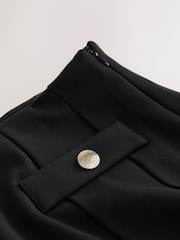 Melns - Ponte Pleated Mini Skirt with Gold Button Detailing - Attēls 5 no 5