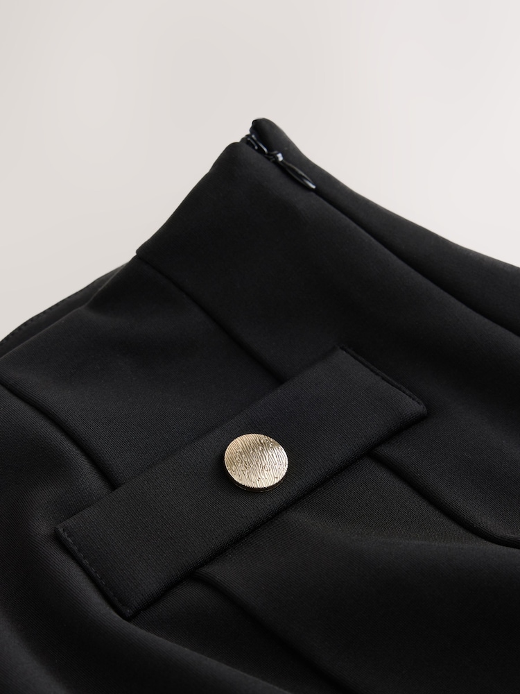 Melns - Ponte Pleated Mini Skirt with Gold Button Detailing - Attēls 5 no 5 Melns - Ponte Pleated Mini Skirt with Gold Button Detailing - Attēls 5 no 5