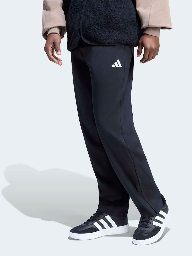 adidas Black Essentials Small Logo Stanford Lite Woven Tapered Open Hem Pants - Image 1 of 6 adidas Black Essentials Small Logo Stanford Lite Woven Tapered Open Hem Pants - Image 1 of 6