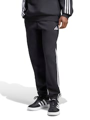 Sort - adidas Essentials 3-Striber fleecetilspidsede joggingbukser med manchetter - Billede 1 af 6