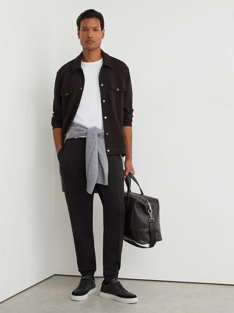 Schwarz - Reiss Finn Premium Interlock Cuffed Joggers - Bild 1 von 6 Schwarz - Reiss Finn Premium Interlock Cuffed Joggers - Bild 1 von 6