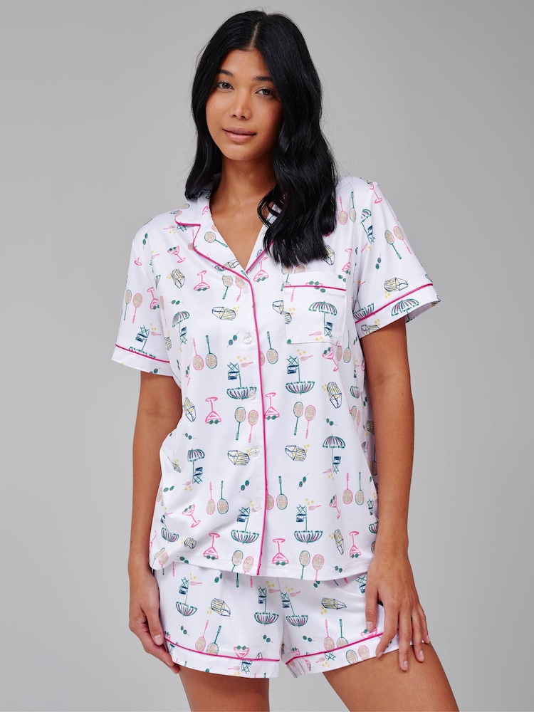 Loungeable Tennis Graphic Short Sleeve Shirt And Shorts Button Through Pyjama Set - Image 1 of 4 Loungeable Tennis Graphic Short Sleeve Shirt And Shorts Button Through Pyjama Set - Image 1 of 4