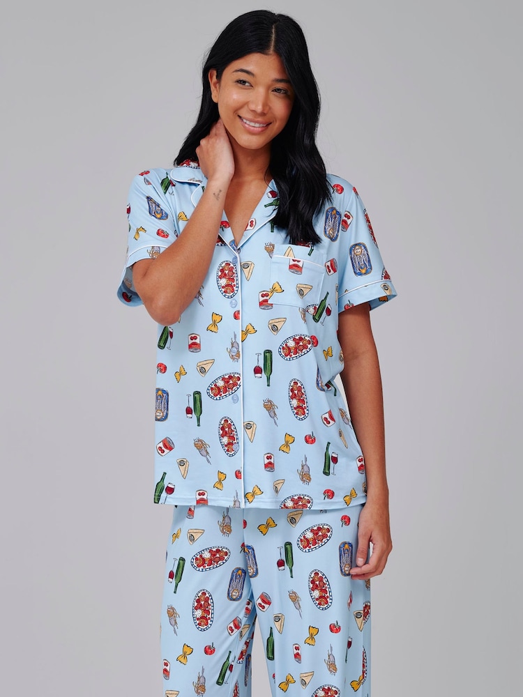 Loungeable Blue Pasta Food Graphic Short Sleeve Shirt And Trousers Button Through Pyjama Set - Image 1 of 5 Loungeable Blue Pasta Food Graphic Short Sleeve Shirt And Trousers Button Through Pyjama Set - Image 1 of 5