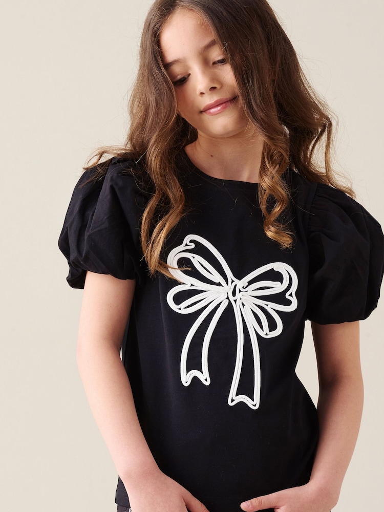 Angel & Rocket Black Aofie Bow Embellished T-Shirt - Image 1 of 7 Angel & Rocket Black Aofie Bow Embellished T-Shirt - Image 1 of 7
