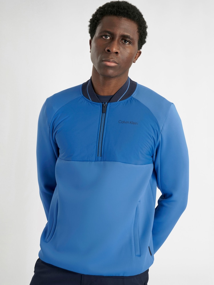 Calvin Klein Golf Blue Greenside 1/2 Zip Hybrid Bomber Jacket - Image 1 of 9 Calvin Klein Golf Blue Greenside 1/2 Zip Hybrid Bomber Jacket - Image 1 of 9