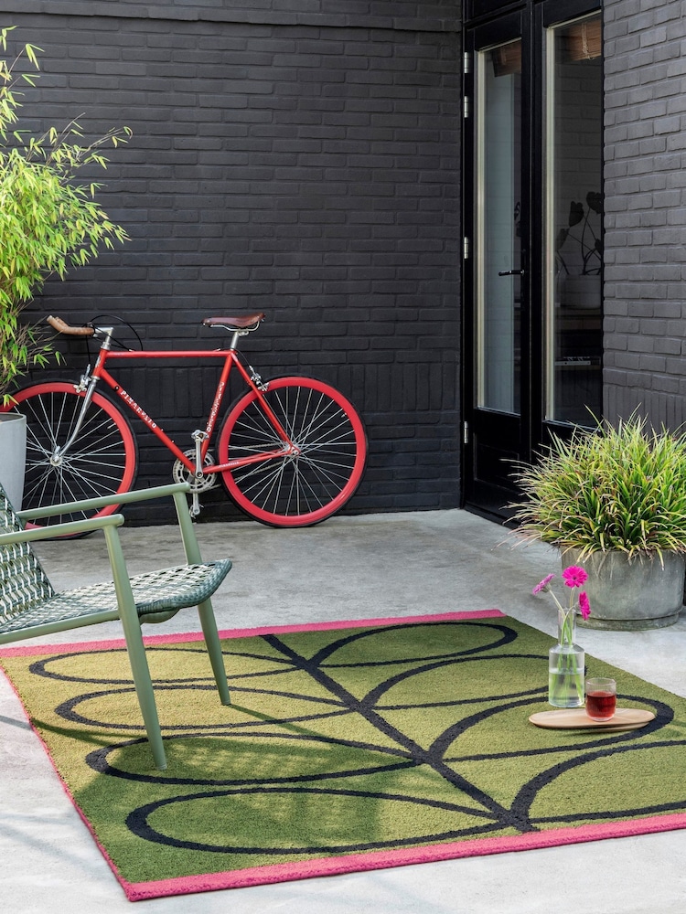 Orla Kiely Olive Linear Stem Outdoor Rug - Image 1 of 4 Orla Kiely Olive Linear Stem Outdoor Rug - Image 1 of 4
