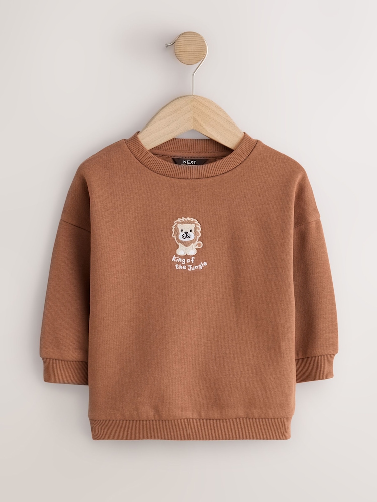 Rust Brown Lion Printed Crew Neck Sweat Top (3mths-7yrs) - Image 1 of 4