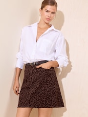 Friends Like These Chocolate Brown Flocked Leopard Print Denim Mini Skirt - Image 1 of 5