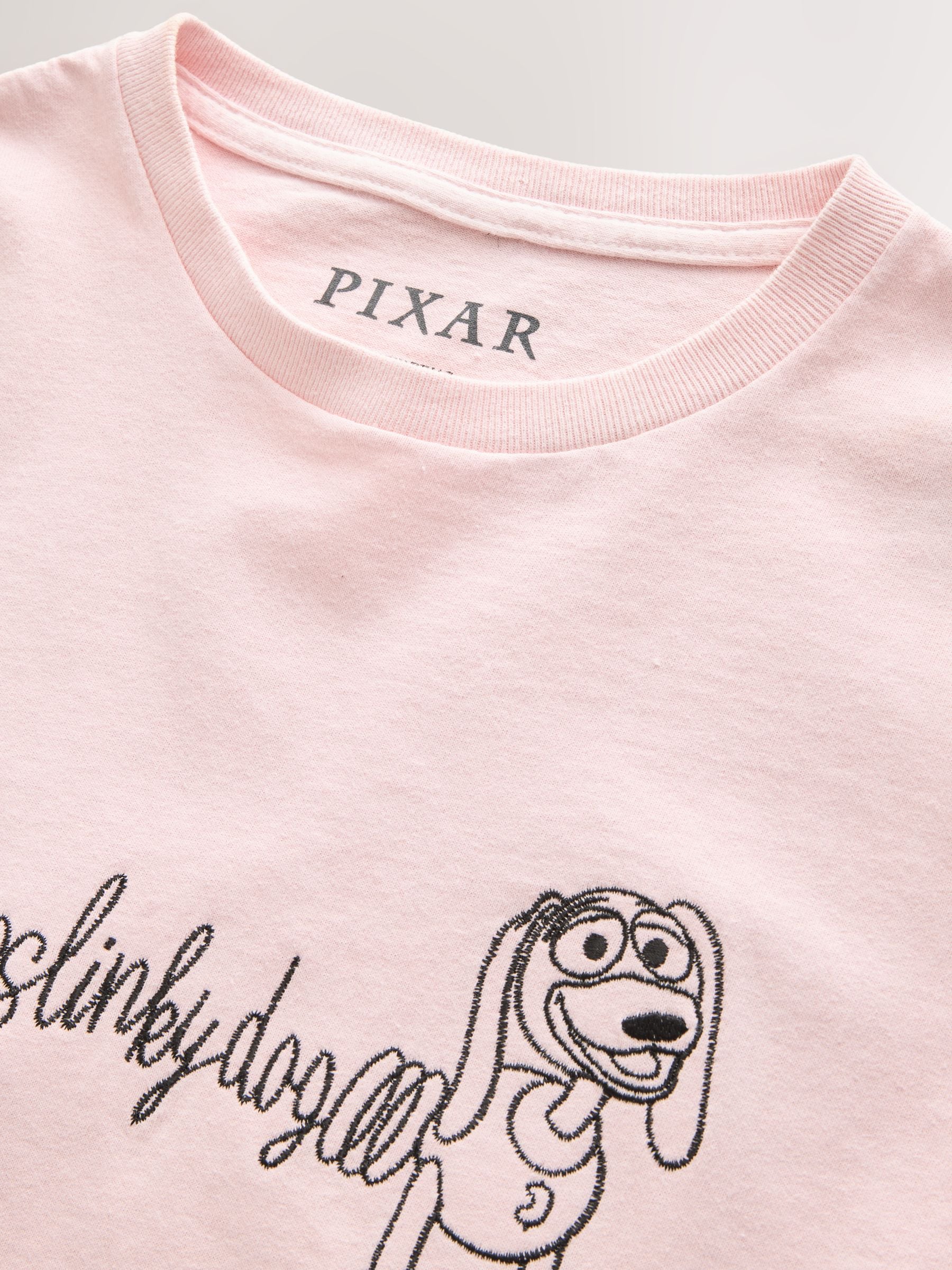 Buy Pink Toy Story Slinky Graphic Slim Fit Crew Neck T-Shirt from