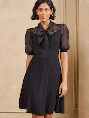 Love & Roses Black Tie Neck Woven Sleeve Sequin Detail Knitted Mini Dress - Image 1 of 5