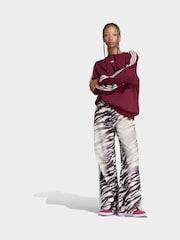 بني - جينز دنيم واسع الأرجل بنقشة حمار وحشي من adidas Originals - صورة 3 من 6
