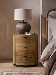 Dark Natural Bronx Oak Effect 3 Drawer Round Bedside Table - Image 1 of 8