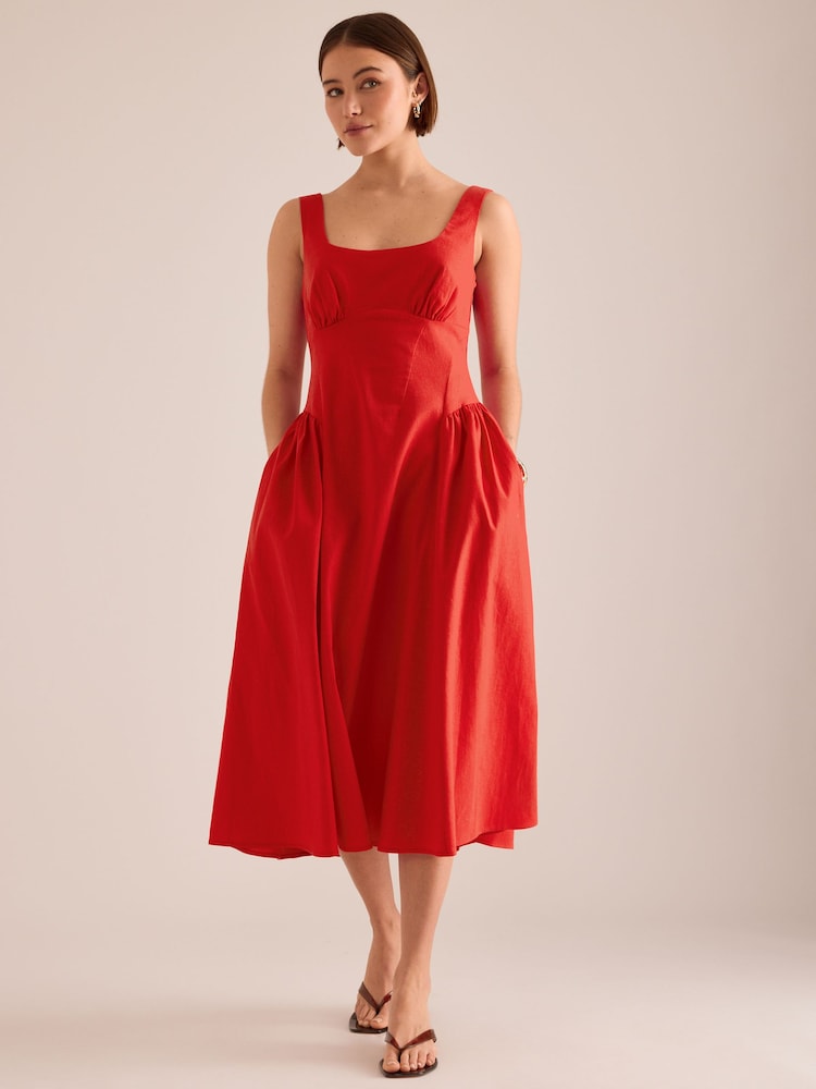 أحمر - فستان متوسط الطول من القطن والكتان بقصّة ساعة رملية من Anthropologie - Image 2 of 4 أحمر - فستان متوسط الطول من القطن والكتان بقصّة ساعة رملية من Anthropologie - Image 2 of 4