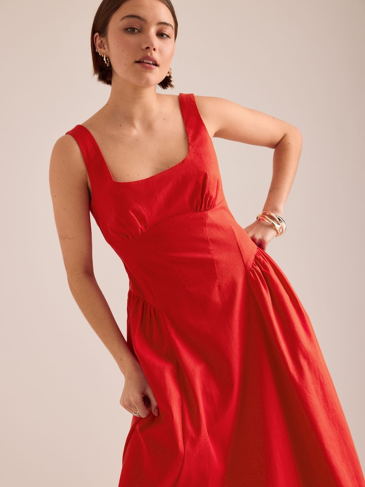 أحمر - فستان متوسط الطول من القطن والكتان بقصّة ساعة رملية من Anthropologie - Image 4 of 4 أحمر - فستان متوسط الطول من القطن والكتان بقصّة ساعة رملية من Anthropologie - Image 4 of 4