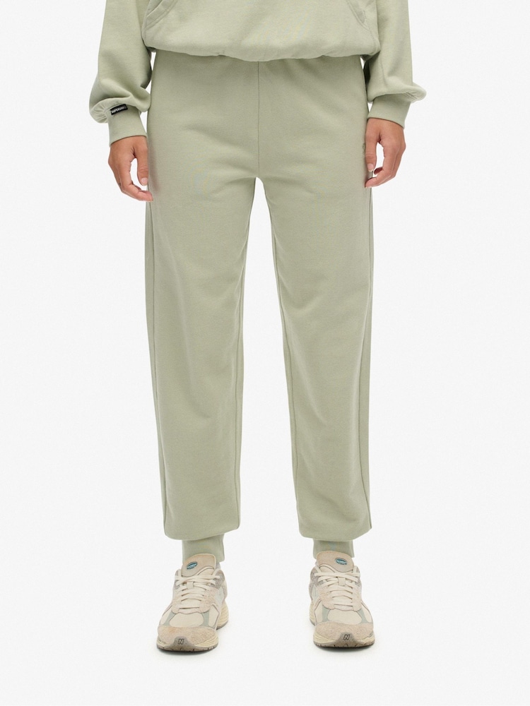 Superdry Green Studios Cuffed Joggers - Image 1 of 7 Superdry Green Studios Cuffed Joggers - Image 1 of 7