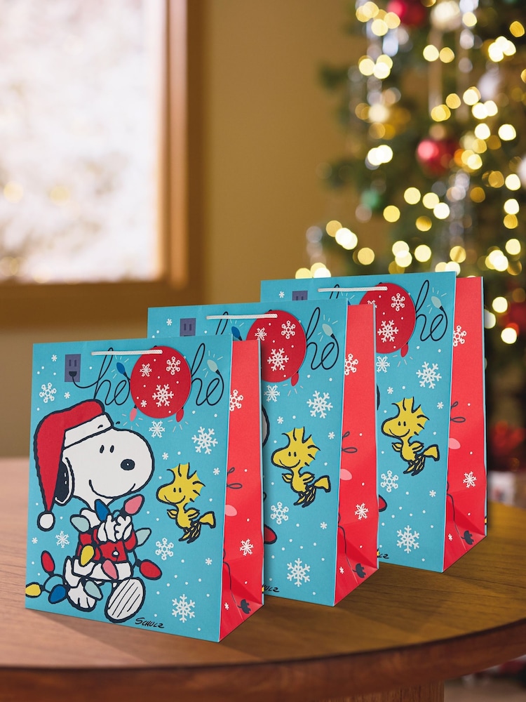 Hallmark Blue 3 Large Peanuts Snoopy Christmas Gift Bags - Image 1 of 5 Hallmark Blue 3 Large Peanuts Snoopy Christmas Gift Bags - Image 1 of 5